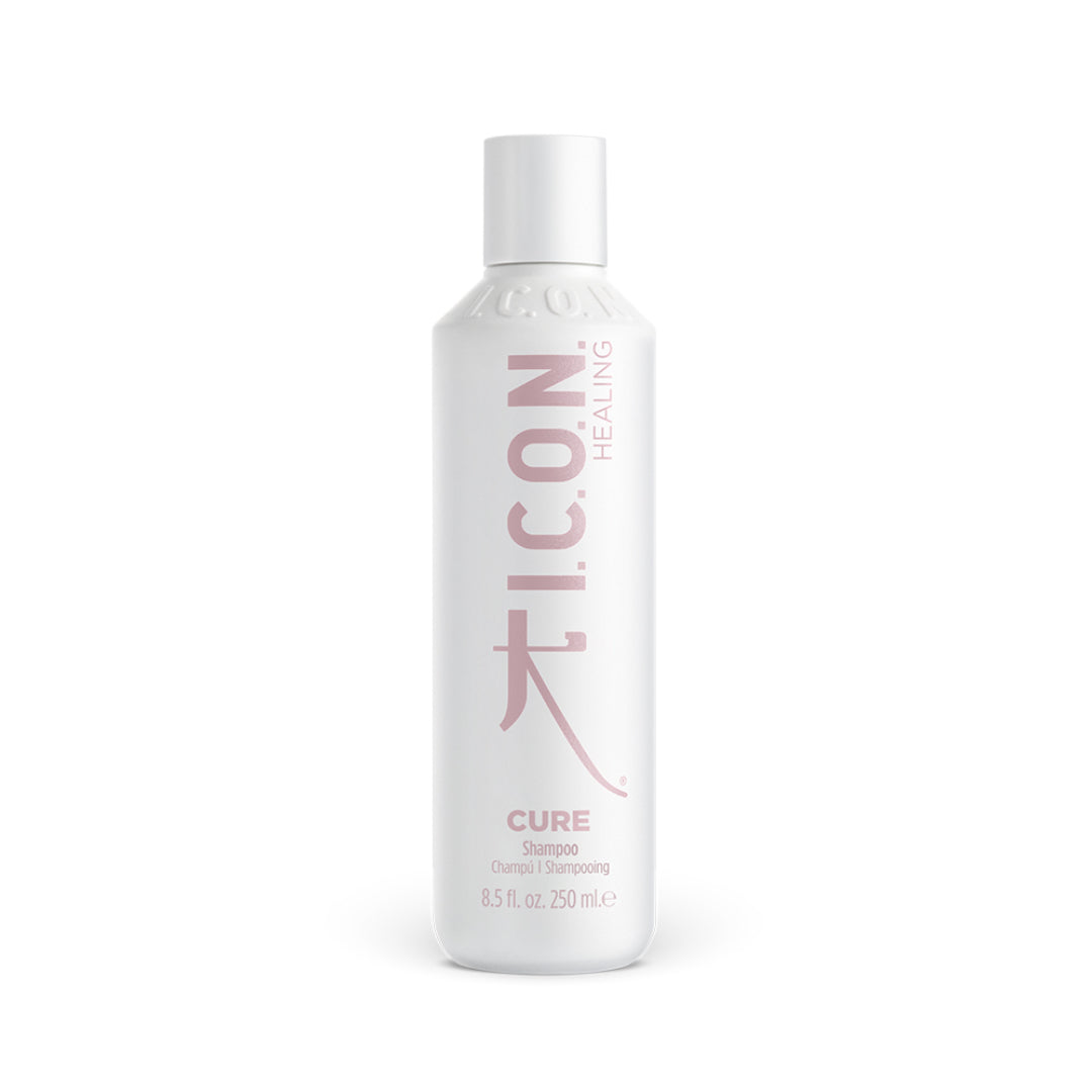 White bottle of I.C.O.N. Cure shampoo on a white background