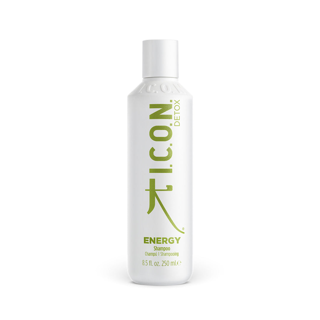 A 250ml white bottle of I.C.O.N. Energy Detoxifying Shampoo by Industry Beauty Supply, with green and gray label text, offers detoxifying benefits powered by organic oils.
