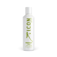 A 250ml white bottle of I.C.O.N. Energy Detoxifying Shampoo by Industry Beauty Supply, with green and gray label text, offers detoxifying benefits powered by organic oils.