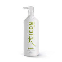 A white bottle of Industry Beauty Supply I.C.O.N. Energy Detoxifying Shampoo with a pump, green text, and 1000mL size, formulated with organic oils to strengthen hair.